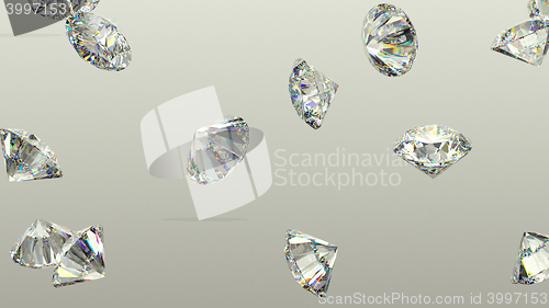 Image of Diamonds scattering or flying away over studio background