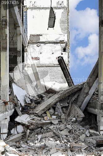 Image of Pieces of Metal and Stone are Crumbling from Demolished Building Floors