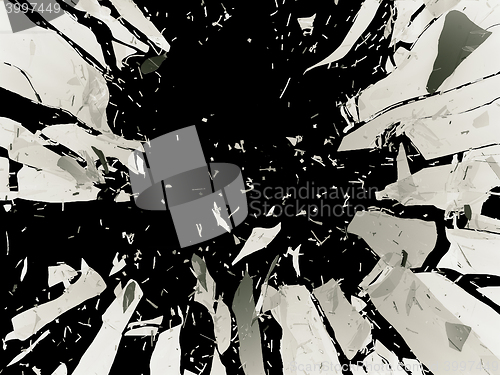 Image of Many pieces of shattered glass isolated over black background