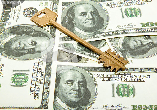 Image of key on dollars