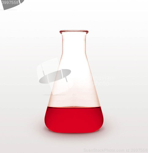 Image of Triangle retort with red liquid on white background
