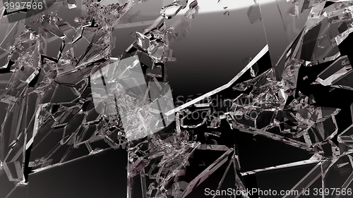 Image of Sharp Pieces of shattered glass isolated on black