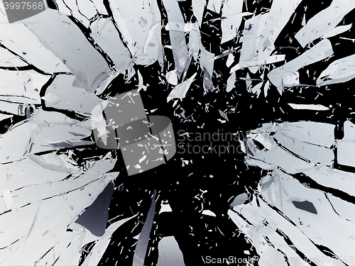 Image of Pieces of Broken Shattered black glass isolated on black
