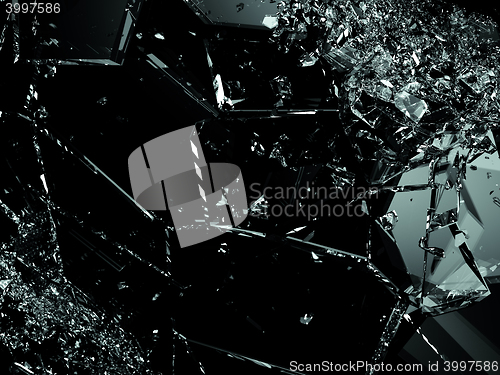 Image of Pieces of splitted or cracked glass on black