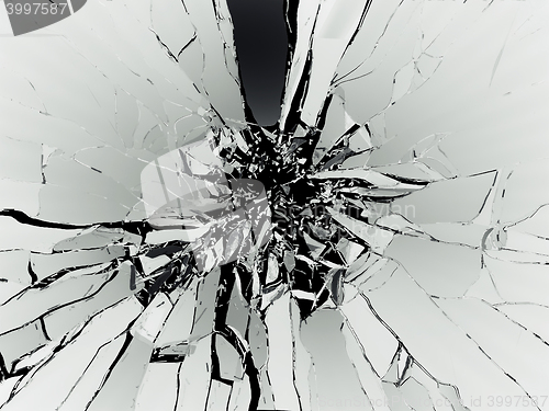 Image of Many pieces of shattered glass on black background