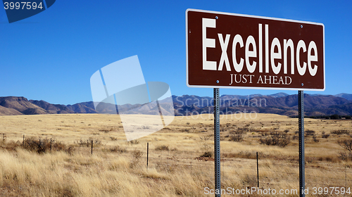 Image of Excellence Just Ahead brown road sign