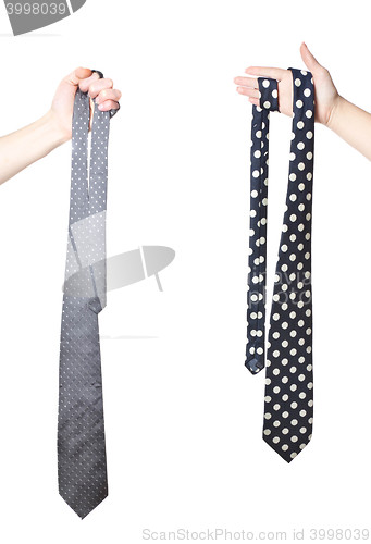 Image of two hand holding tie\'s