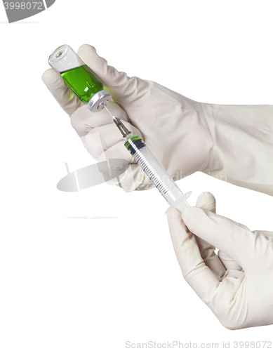 Image of Hand holding syringe isolated on white