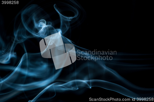 Image of Beautiful smoke on the black background - macro photo