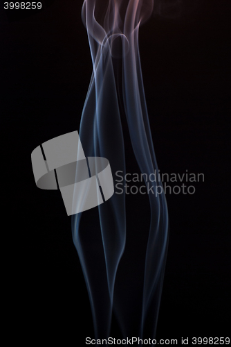 Image of Beautiful smoke on the black background - macro photo