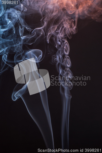 Image of Beautiful smoke on the black background - macro photo