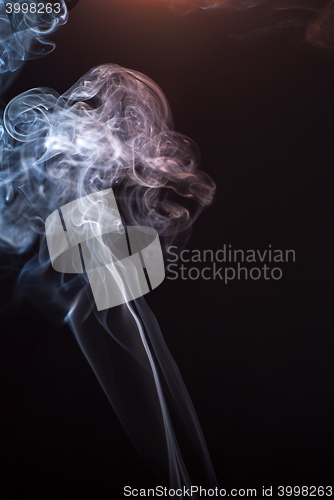 Image of Beautiful smoke on the black background - macro photo