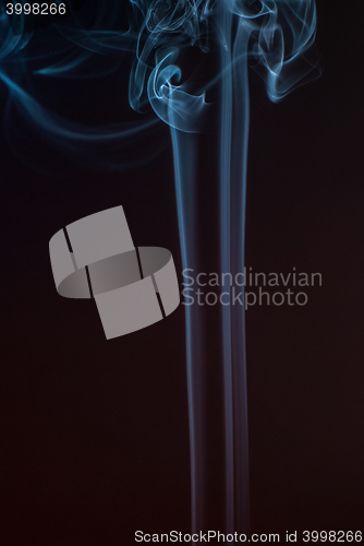 Image of Beautiful smoke on the black background - macro photo