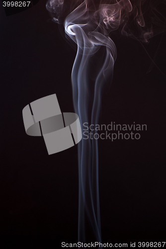 Image of Beautiful smoke on the black background - macro photo