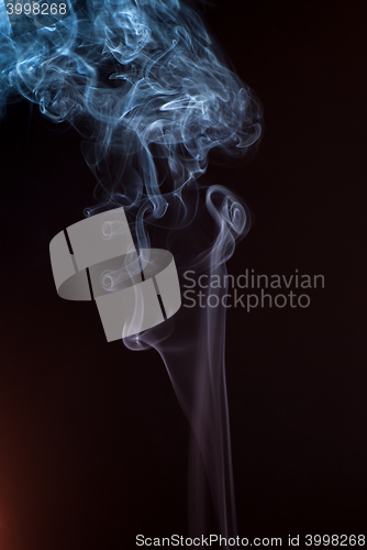 Image of Beautiful smoke on the black background - macro photo
