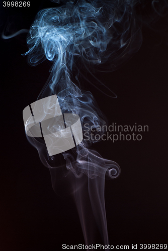 Image of Beautiful smoke on the black background - macro photo