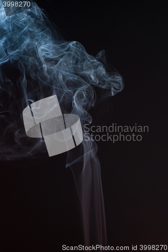 Image of Beautiful smoke on the black background - macro photo