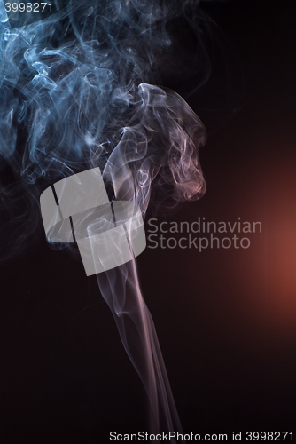 Image of Beautiful smoke on the black background - macro photo