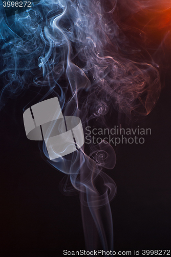 Image of Beautiful smoke on the black background - macro photo