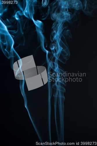 Image of Beautiful smoke on the black background - macro photo