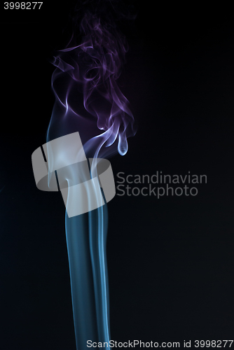 Image of Beautiful smoke on the black background - macro photo