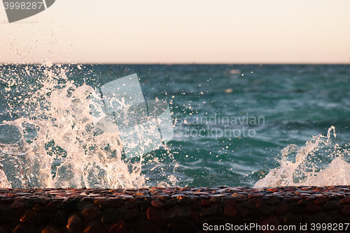 Image of Photo closeup of beautiful clear turquoise sea ocean water surface with ripples and bright splash on seascape background, horizontal picture