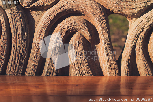 Image of Wooden bench in the summer park. Closeup