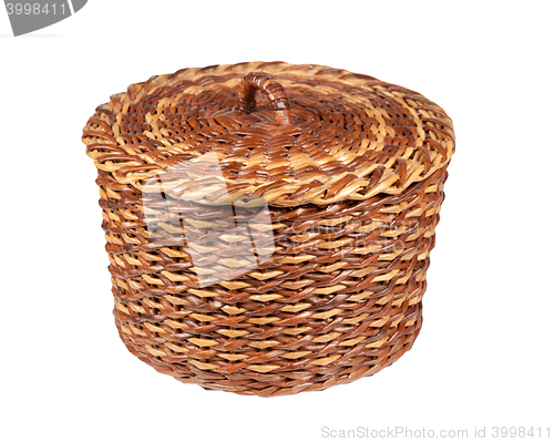 Image of basket brown-yellow made using newspaper tubes