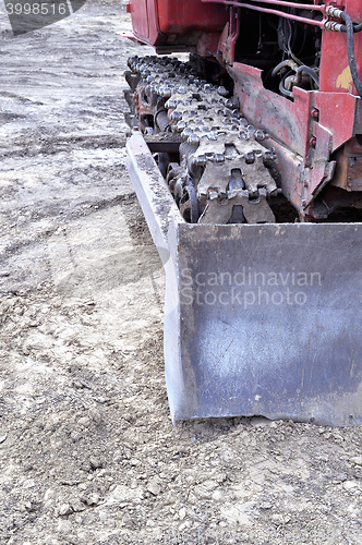 Image of Old caterpillar bulldozer working on construction site