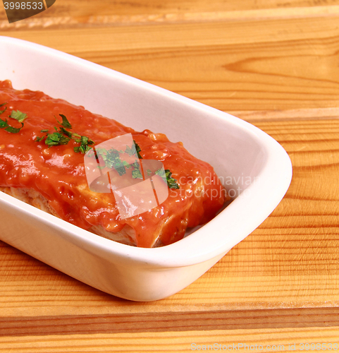 Image of red lasagna isolated on wooden background