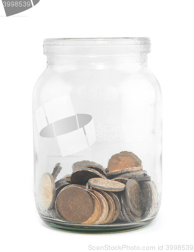 Image of coins in glass savings or tips bottle