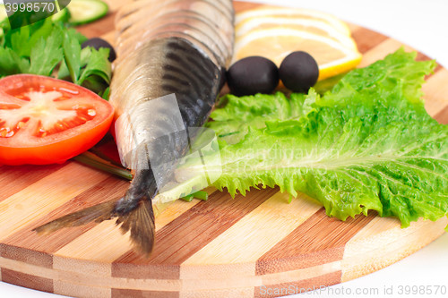 Image of sliced herring with vegetables