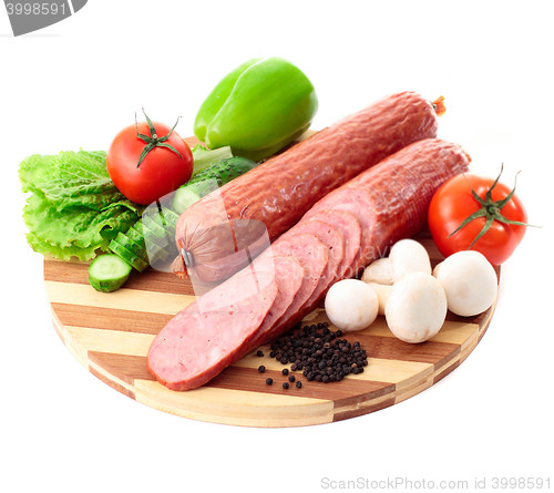 Image of sausage on plate with vegetables