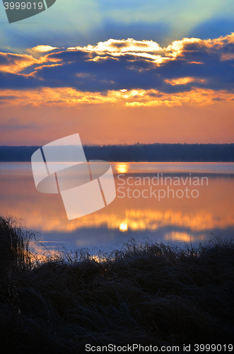 Image of Sunrise over the lake early in the morning with beautiful clouds