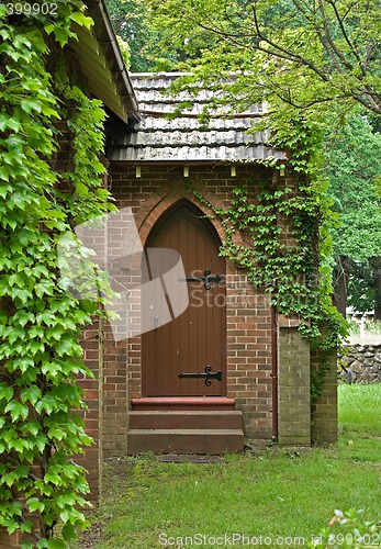 Image of vine covered church building