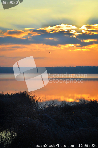 Image of Sunrise over the lake early in the morning with beautiful clouds