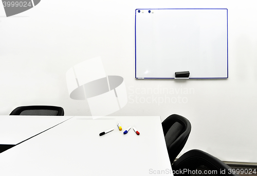 Image of Empty meeting room in the office with tables and chairs