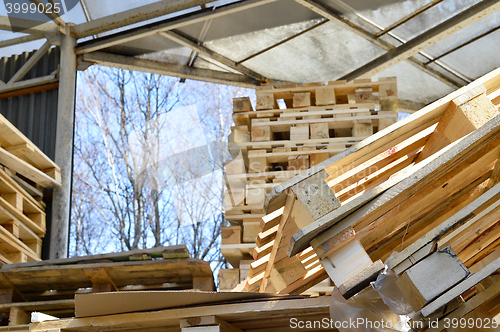 Image of Waste wood from pallets stacked in the storage room