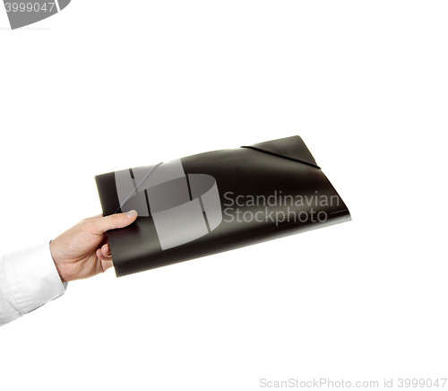 Image of hand holding a folder