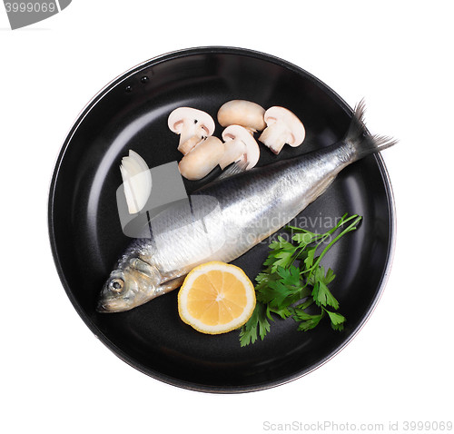 Image of fish in pan with vegetables