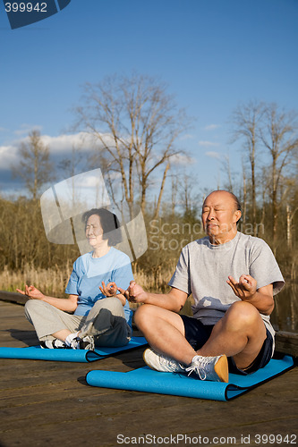 Image of Senior asian couple exercise