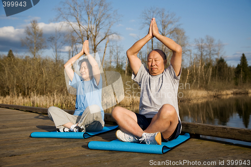 Image of Senior asian couple exercise