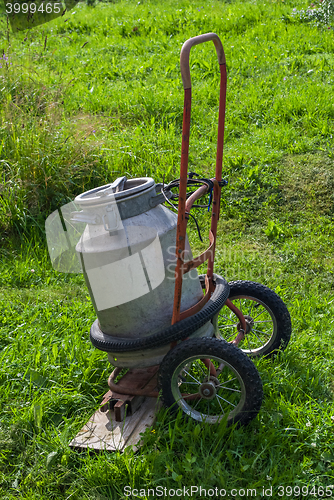 Image of The can on a wheelbarrow.