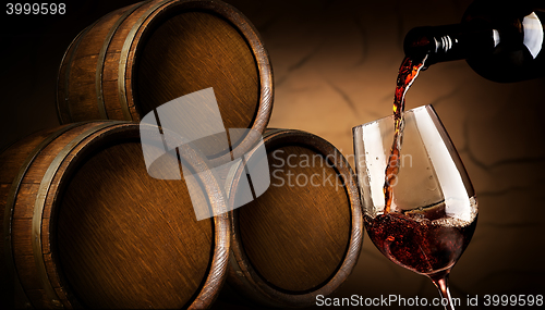 Image of Pouring wine in cellar