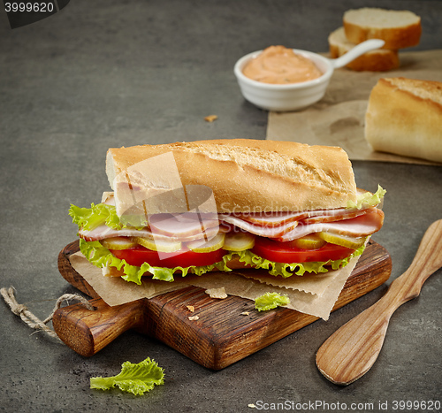 Image of sandwich with smoked meat and vegetables