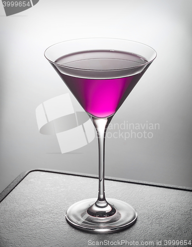 Image of glass of violet cocktail
