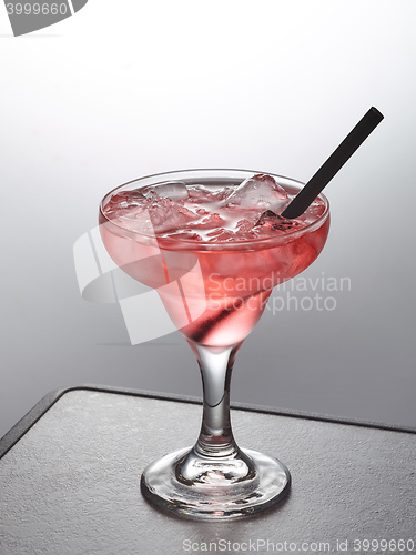 Image of glass of pink iced cocktail