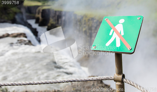 Image of Forbidden to walk over here - Iceland - Fierce waterfall in back