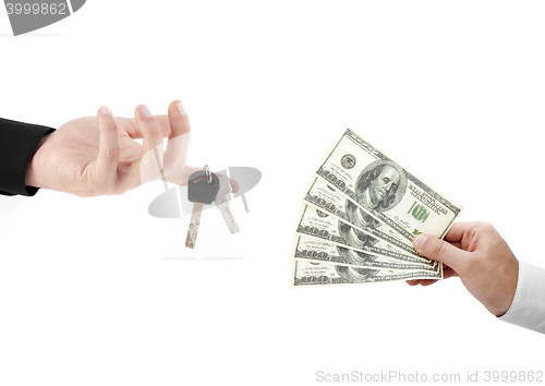 Image of hands holdind money and car keys