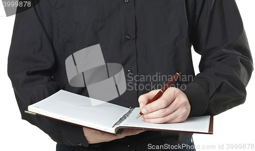 Image of businessman taking note in a notepad